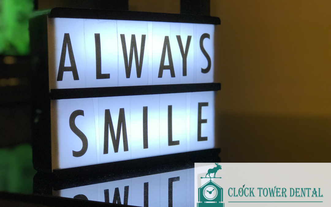 A backlit sign saying “Always Smile”